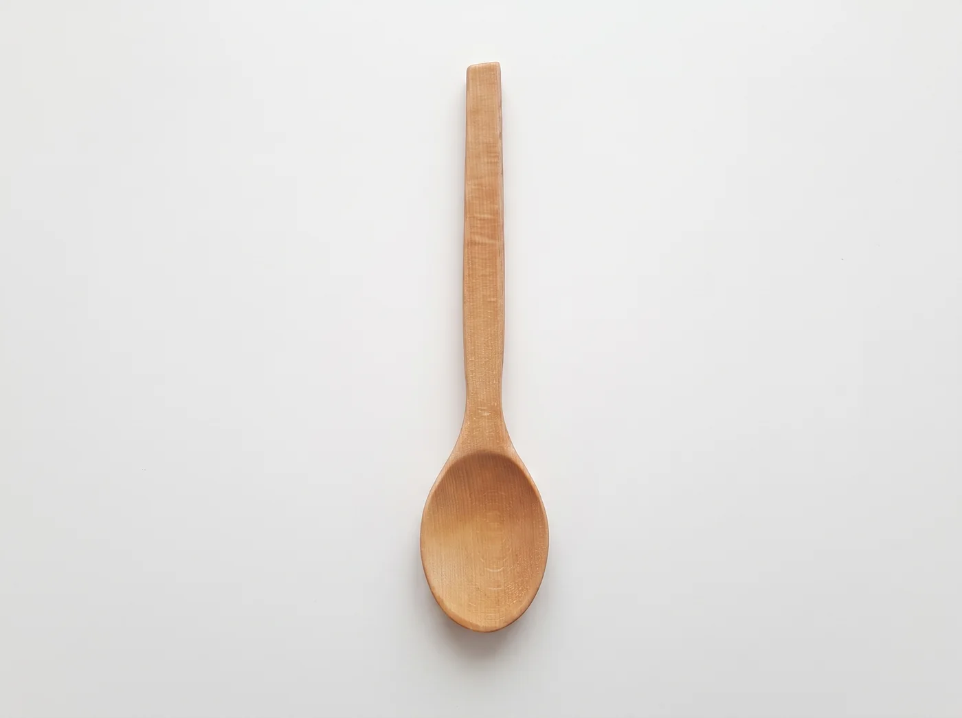 Beech wood cooking spoon photographed from above